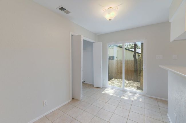 Empty room featuring light tile patterned floors | Image 9