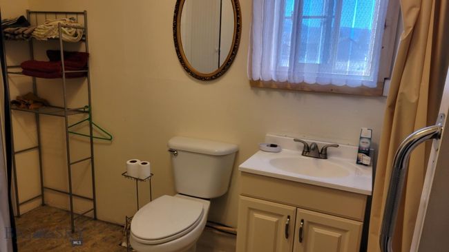 Bathroom featuring vanity and toilet | Image 5