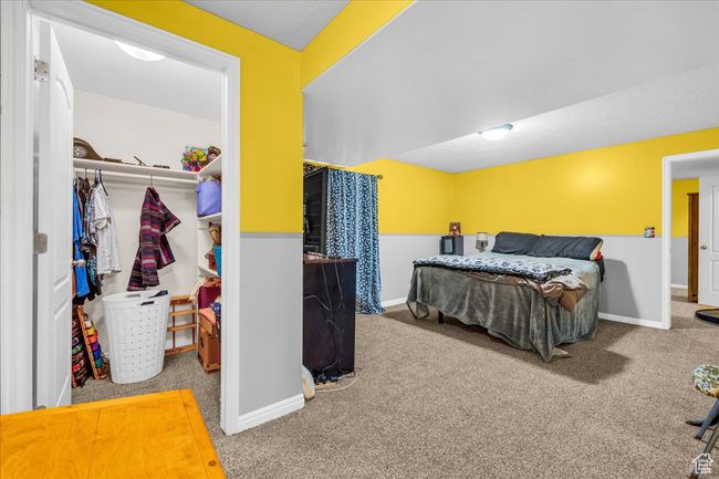 Carpeted bedroom featuring baseboards and a closet | Image 15