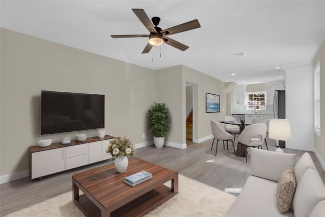 Living area with baseboards, visible vents, stairway, and light wood finished floors | Image 4