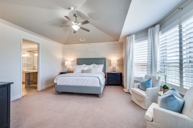 Primary suite features decorative wall and en suite bath. Did we mention how spacious this room feels? | Image 18