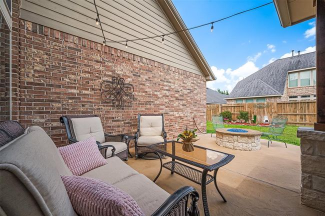 Beyond the covered patio, the expansive decking provides the perfect spot for your outdoor lounge or dining set—ideal for soaking up the sun or hosting guests. | Image 41