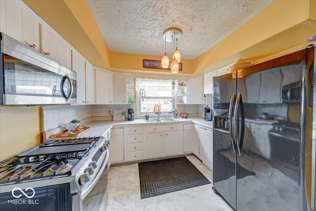 nice storage for kitchen items and a window | Image 18