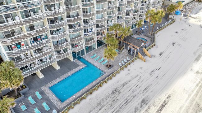 Bird's eye view of apartment complex / building and a pool area | Image 22