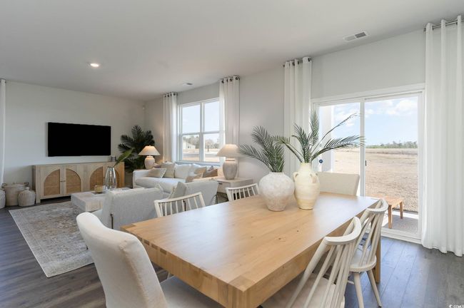 Dining space featuring dark hardwood / wood-style floors | Image 10