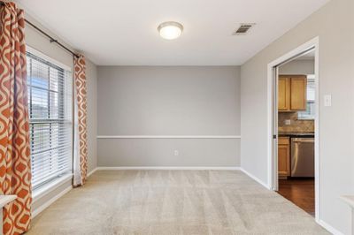 This formal dining room is located right off the den and the kitchen. In some homes in Timbergrove with similar floor plans, this space has been turned into a home office. | Image 3