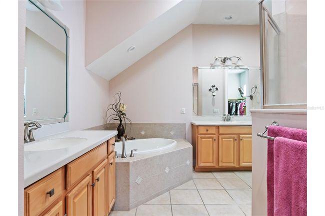 Downstairs master Bath with garden tub & shower. | Image 13