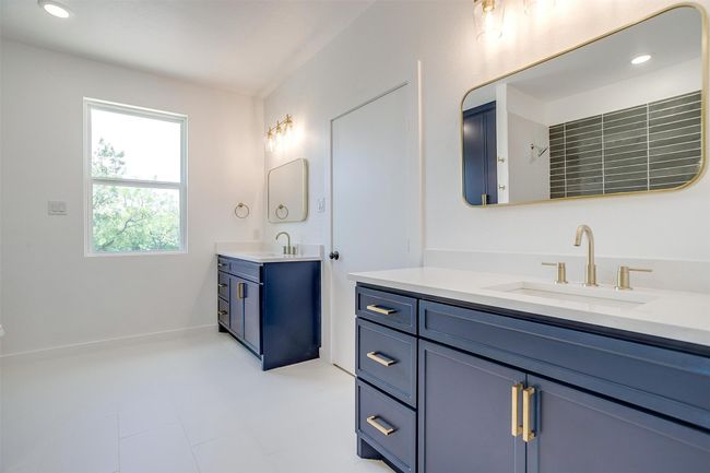 Bathroom with two vanities and a sink | Image 20