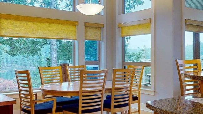 Dining room featuring ocean view, wood beams and a towering ceiling | Image 10