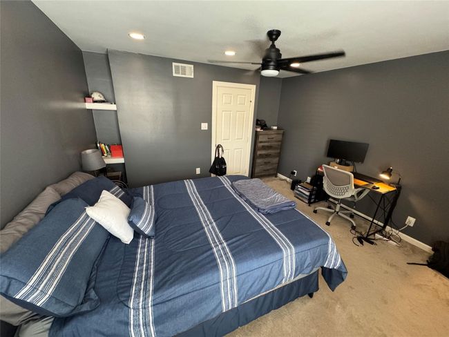 Bedroom featuring carpet floors, baseboards, ceiling fan, recessed lighting, and an office area | Image 9