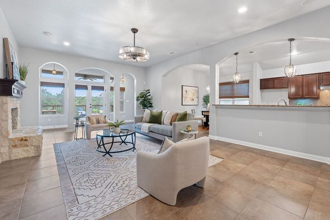 Living area featuring arched walkways, recessed lighting, baseboards, and ceiling fan | Image 8