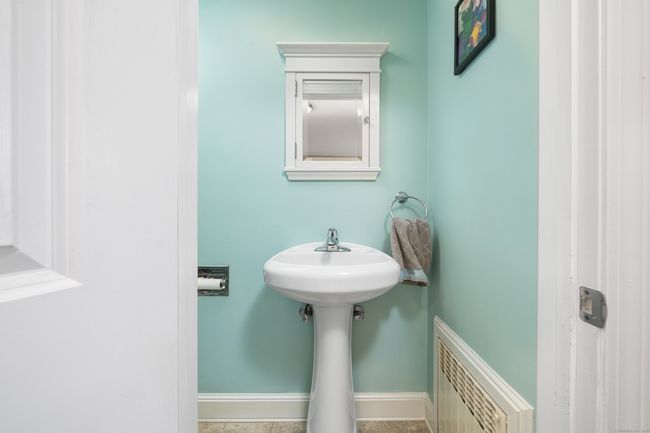 Adorable powder room off kitchen | Image 14