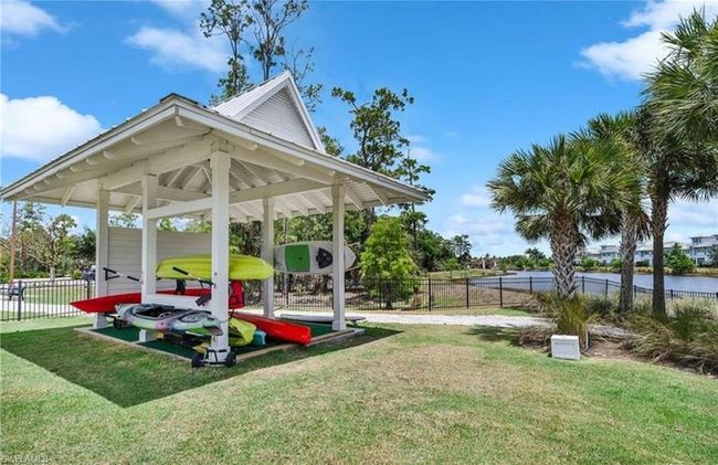 View of home's community with a yard and a water view | Image 26
