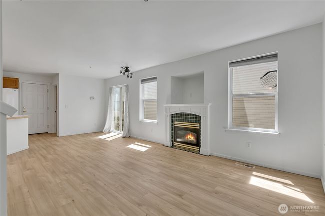 Living room features a gas fireplace | Image 5