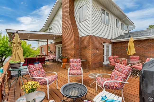 Deck featuring outdoor lounge area, french doors, and outdoor dining space | Image 4
