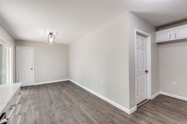 Unfurnished dining area with dark wood-style floors | Image 10