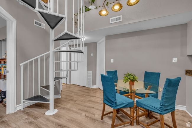 Dining area featuring visible vents and wood finished floors | Image 4