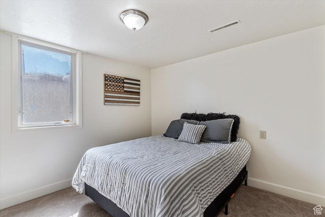 Bedroom featuring carpet | Image 28