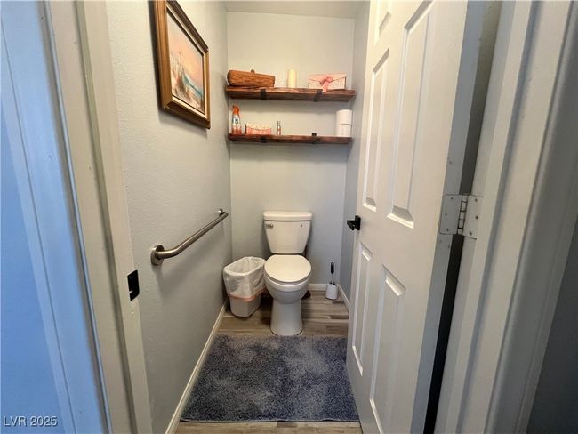 Bathroom with wood finished floors and toilet | Image 46