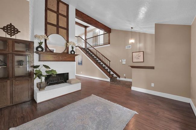 Vaulted ceilings and a cozy fireplace make this room perfect for so many uses! | Image 4