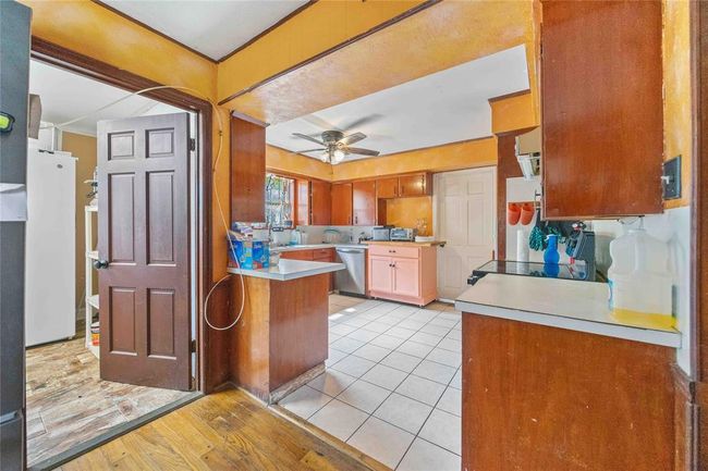 This is a view from the breakfast room. Inside utility is on the left. | Image 6