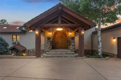 Stunning Covered entrance with custom carved doors! | Image 2