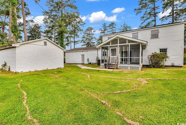 Back of property with a sunroom and a lawn | Image 29
