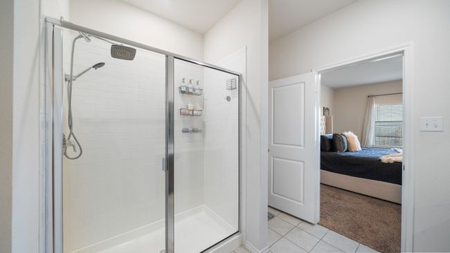 Ensuite bathroom featuring a stall shower and tile patterned flooring | Image 17