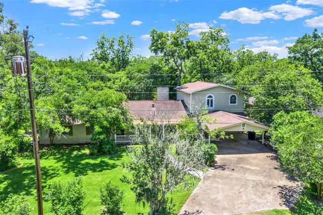 Double wide driveway with a carport. | Image 4