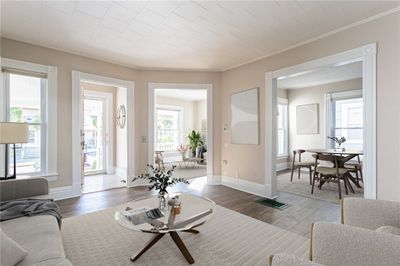 Virtually Staged living, sitting and dining areas. | Image 2