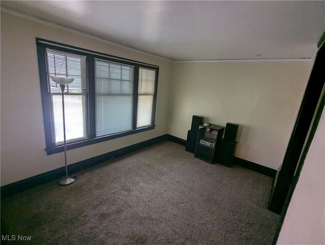 Second-Floor Living room featuring dark colored carpet and crown molding | Image 16