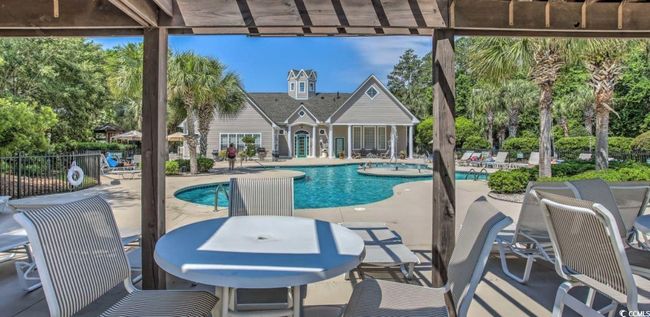 Community pool with a patio area | Image 22