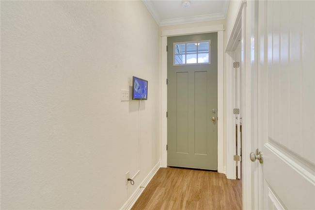Entryway featuring light wood-type flooring and crown molding | Image 5