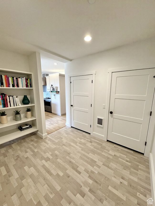 Hall featuring recessed lighting and light wood finished floors | Image 9