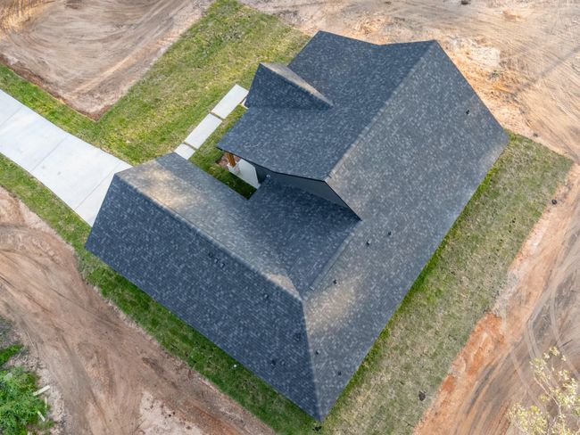 This clean aerial showcases the multiple roof peaks and quality construction—designed for both curb appeal and functional weather resistance. | Image 41