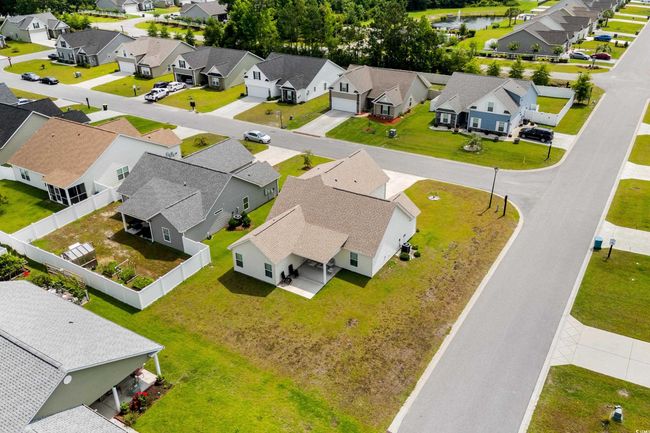 Aerial view of residential area featuring a large body of water | Image 30