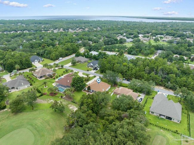 7008 Turnberry Cir, House other with 4 bedrooms, 2 bathrooms and 3 parking in Navarre FL | Image 65