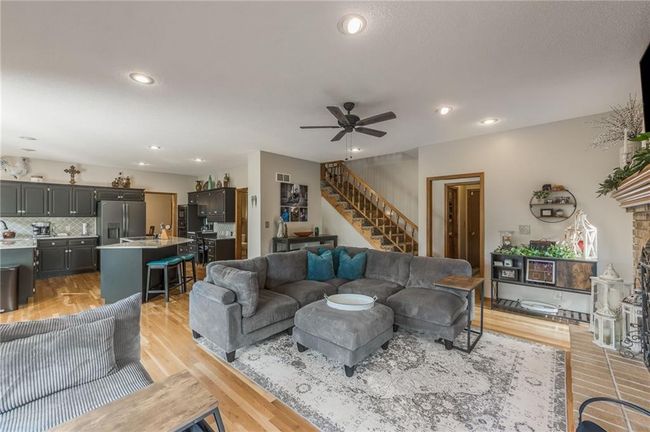 Living area featuring stairs, recessed lighting, ceiling fan, and light wood-type flooring | Image 30