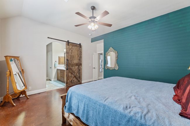 Full bathroom with double vanity, a spacious closet, tiled shower, and a sink | Image 14