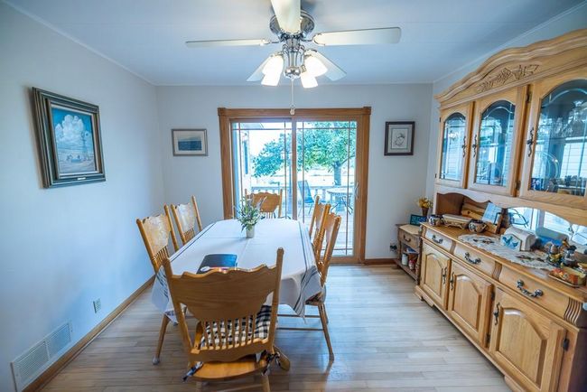 Dining room featuring ceiling fan, light hardwood / wood-style flooring, and crown molding | Image 7