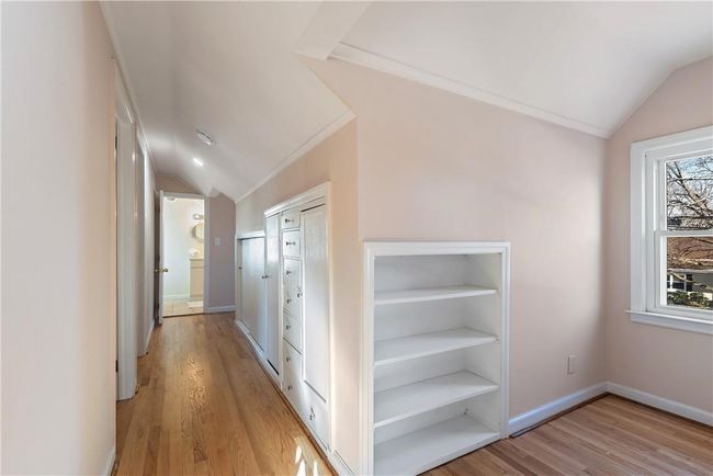 Upstairs hallway lined with many closets | Image 23