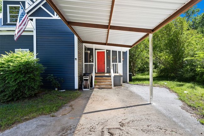 Carport side entrance into laundry/ pantry | Image 11