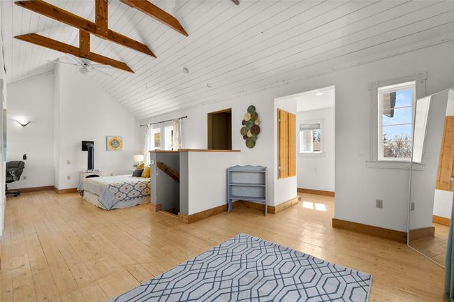 Bedroom featuring high vaulted ceiling, beamed ceiling, and light wood-type flooring | Image 17