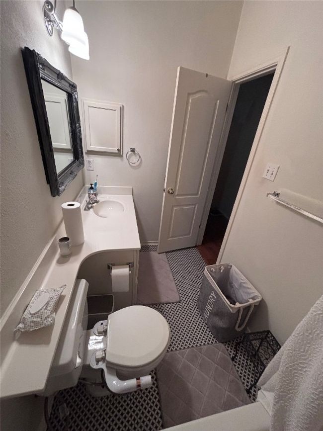 Bathroom featuring tile patterned floors and vanity | Image 11