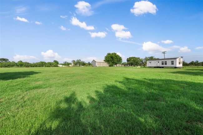 View of green lawn featuring a view of rural / pastoral area | Image 8
