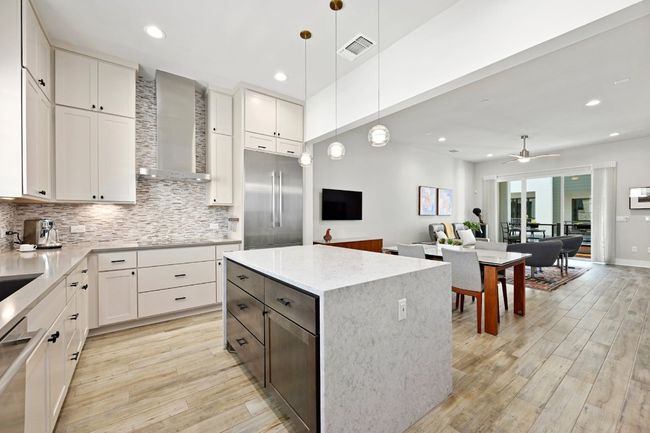Spacious island in kitchen offers plenty of room to offer a beautiful spread or to enjoy your morning coffee. | Image 7