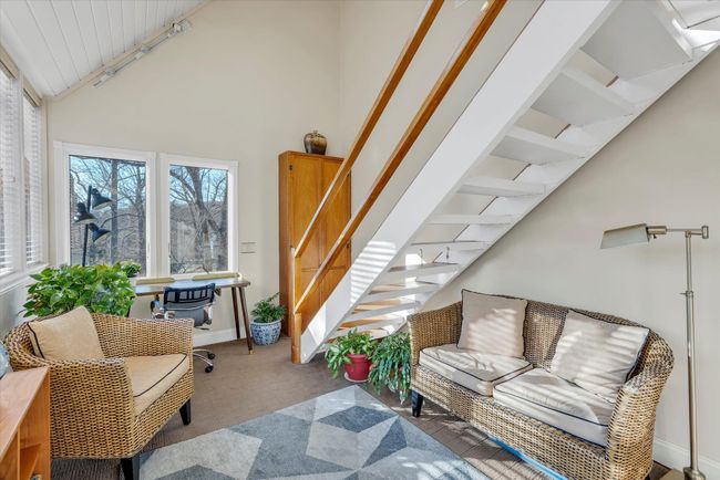 Living room with track lighting and high vaulted ceiling | Image 12