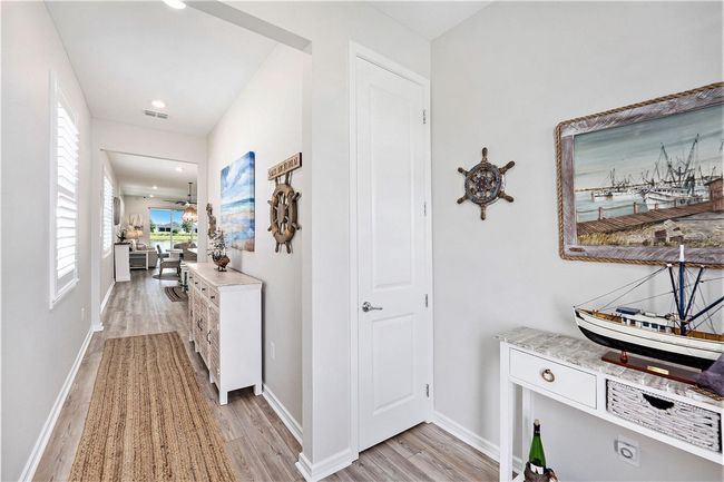 Welcoming wide foyer, with coat closet, is a showcase space that leads you to a beautiful home. | Image 4