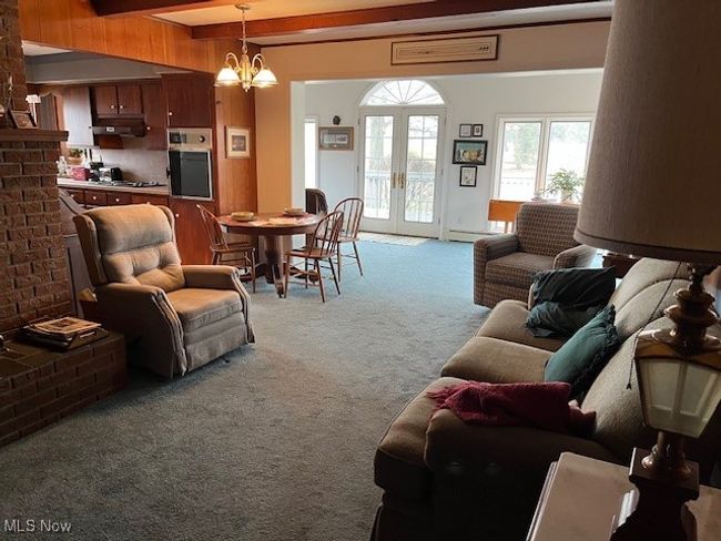 open view from family room into kitchen & sun room | Image 14