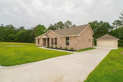 Beautiful single story brick home with a open layout, huge covered patio, detached garage and no back neighbors. | Image 3